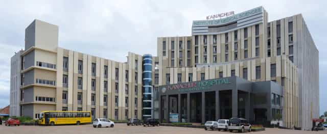 Kanachur Institute of Medical Sciences building with rooftop signage and Kanachur Hospital & Research Centre entrance, Deralakatte, Mangalore