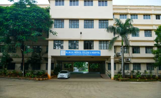 MIMER Medical College and Hospital building with its blue signboard at Talegaon Dabhade, Pune