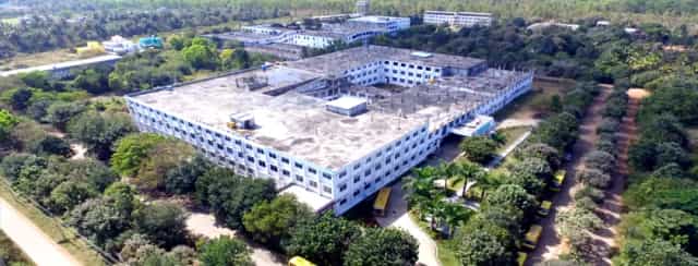 Aerial view of the Sambhram campus at KGF, Kolar, with white college and hospital blocks among greenery (archived college photo, 2024)