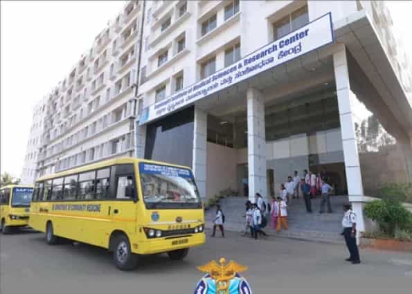 Sapthagiri Institute of Medical Sciences building with college bus, Chikkasandra, Bengaluru