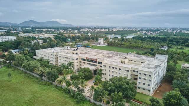 Aerial drone view of the Shridevi Institute of Medical Sciences and Research Hospital campus on Sira Road, Tumakuru, surrounded by greenery