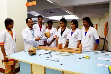 Faculty demonstrating a skull to MBBS students in the Forensic Medicine anthropometry laboratory at ACS Medical College and Hospital, Chennai