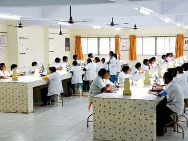 MBBS students using microscopes in the Pathology laboratory at ACS Medical College and Hospital, Chennai