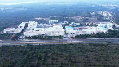 Aerial view of the Adichunchanagiri University and AIMS campus at B.G. Nagara beside National Highway 75