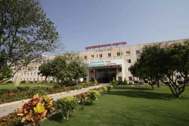 Front facade and lawns of the Adichunchanagiri Hospital & Research Centre teaching hospital at B.G. Nagara