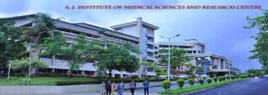Students walking past the A J Institute of Medical Sciences and Research Centre building, Mangalore