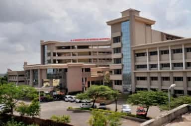 A J Institute of Medical Sciences campus buildings seen from the approach road, Kuntikana