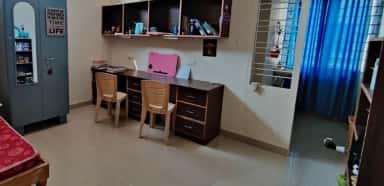 Student hostel room at Akash Institute of Medical Sciences, Devanahalli