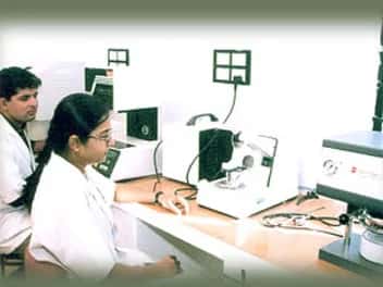 Technicians at work in a clinical laboratory of Al-Ameen Medical College