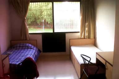 Hostel room with two beds at the Apollo Institute of Medical Sciences and Research student hostel