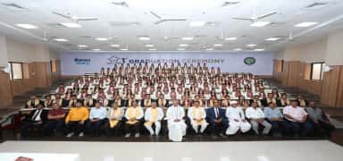 First graduation ceremony of Banas Medical College & Research Institute with graduands and dignitaries in a tiered hall