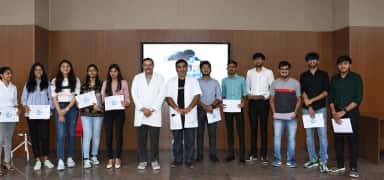 Students receiving certificates with faculty at Banas Medical College & Research Institute, Palanpur
