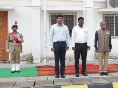 Independence Day flag-hoisting ceremony with an NCC cadet and faculty at Bhaarat Medical College & Hospital, Chennai