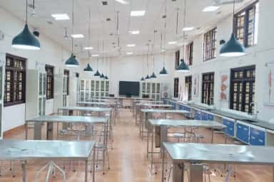 Anatomy dissection hall with dissection tables and anatomical charts at BAVMC Pune