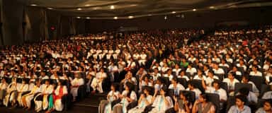 Students filling the auditorium during a campus event at Chettinad Academy of Research and Education