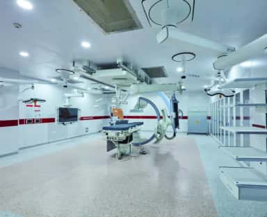 Modern operating theatre with C-arm imaging equipment at the Christian Medical College teaching hospital, Vellore