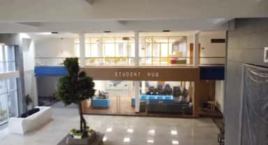 Double-height Student Hub lobby and seating lounge at Datta Meghe Medical College, Nagpur
