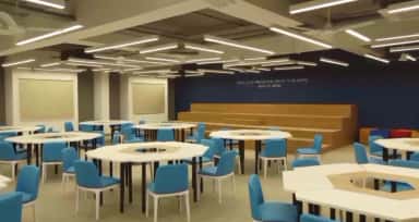 Activity-based learning room with hexagonal tables and tiered seating at Datta Meghe Medical College, Nagpur