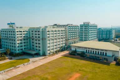 Aerial view of the Owaisi Hospital & Research Centre blocks and the auditorium and sports centre at the DCMS campus, Kanchanbagh, Hyderabad