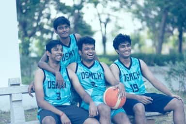 Students in DSMCH sports jerseys with a basketball on the campus of Dhanalakshmi Srinivasan Medical College