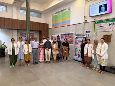 Staff and students at a health awareness programme in the hospital lobby, Dr. B.R. Ambedkar Medical College & Hospital, Bengaluru