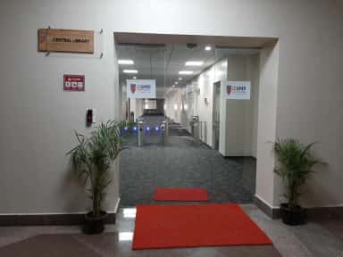 Entrance to the CDSIMER Central Library with signage and access gates
