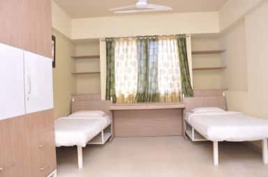 A furnished hostel room at Dr. D. Y. Patil Medical College, Pimpri, Pune