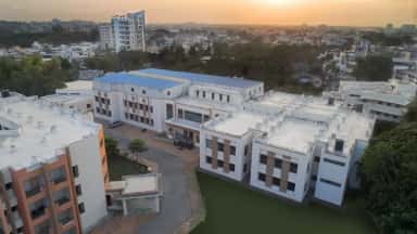 Aerial view of the Dr. Kiran C. Patel Medical College academic complex at Bharuch at dusk