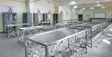 Anatomy dissection hall with stainless-steel dissection tables at Dr. Kiran C. Patel Medical College, Bharuch