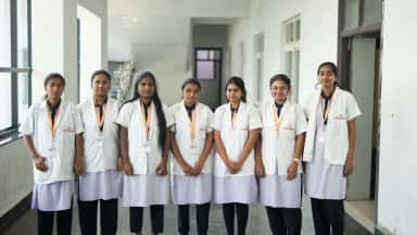 Students of Dr. Patnam Mahender Reddy Institute of Medical Sciences in a college corridor at Chevella