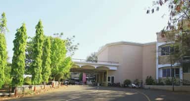 Campus drive and building wing at Dr. Vasantrao Pawar Medical College, Nashik