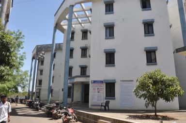 Boys' hostel block at Dr. Vasantrao Pawar Medical College, Nashik, with the anti-ragging notice board at its entrance