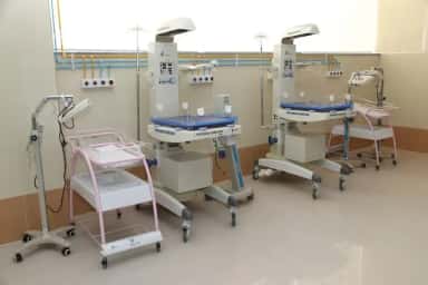 Neonatal intensive care unit with infant warmers at East Point Hospital, Bengaluru