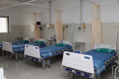 General ward with hospital beds and bedside monitors at East Point Hospital, Bengaluru
