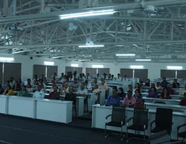Students seated in a large lecture hall at FAME, Mysuru