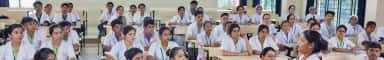 MBBS students in white coats attending a lecture at Father Muller Medical College, Mangalore
