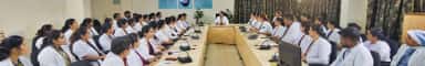 Faculty members of Father Muller Medical College seated around the council meeting table