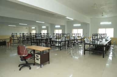 Microscopy hall with rows of benches and wrapped microscopes at GR Medical College Mangalore