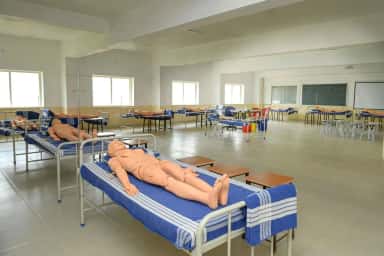 Clinical skills laboratory with training manikins on hospital beds, GR Medical College Mangalore