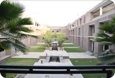 Landscaped courtyard with a central water channel between the academic blocks of GAIMS Bhuj