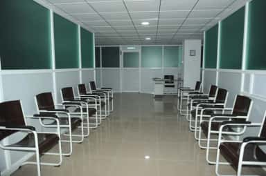 Outpatient department waiting area with rows of seating at Indira Medical College & Hospitals, Pandur