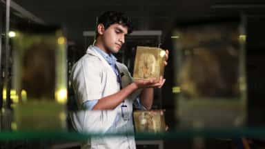 Medical student examining a preserved anatomy specimen in the museum on the KAHER JNMC campus