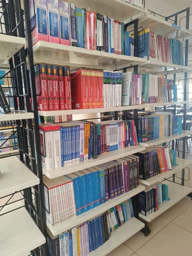 Medical textbook stacks labelled KLE JGMMC Library at KLE JGMM Medical College, Hubballi