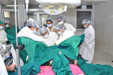Surgical team at work in an operation theatre of Bapuji Hospital, JJM Medical College Davangere