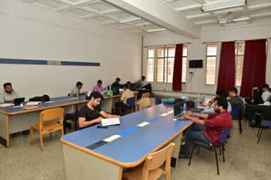 Students studying in a common room at JSS Medical College, Mysuru