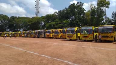 Fleet of NITTE college buses lined up for student transport at K S Hegde Medical Academy, Mangalore