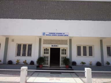Entrance portico of Block-I at Kamineni Academy of Medical Sciences, Hyderabad, with the college name board
