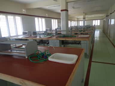 Physiology / biochemistry laboratory with sink-fitted work benches at Kamineni Academy of Medical Sciences, Hyderabad