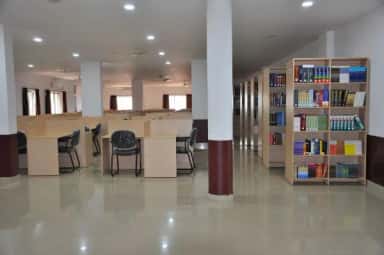 Library reading hall with study desks and medical bookshelves at Kanachur Institute of Medical Sciences