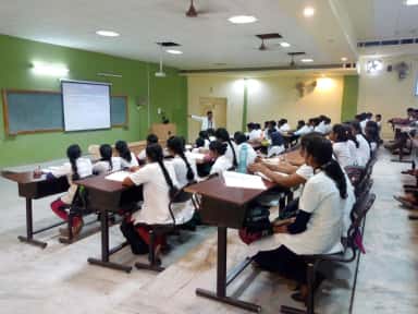 MBBS students in white coats in a teaching hall at Karpaga Vinayaga Institute of Medical Sciences